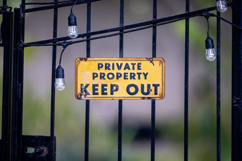 Private property gate sign warning with lights