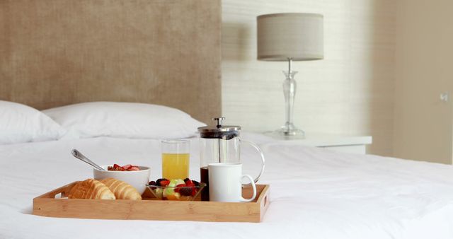 Breakfast tray on bed at home 