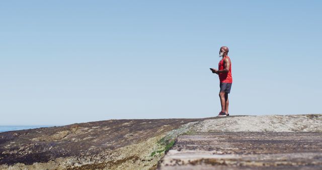 Man Exploring Cliffside With Virtual Reality Headset on Sunny Day - Download Free Stock Images Pikwizard.com