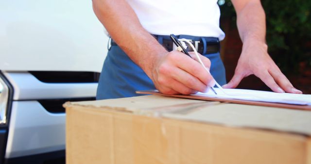 Courier signing documents on delivery package, logistics service concept - Download Free Stock Images Pikwizard.com