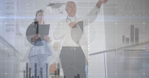 Medical Professionals Analyzing Digital Data in Hospital Setting