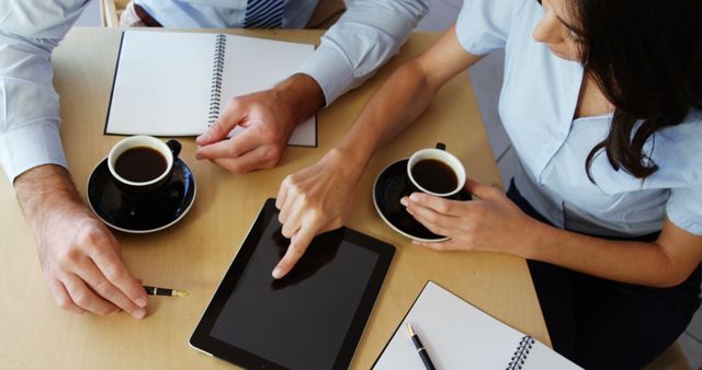 Colleagues Discussing Ideas During Coffee Break with Tablet - Download Free Stock Images Pikwizard.com