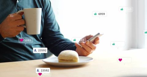 Sipping morning coffee while scrolling smartphone, bun on plate and social media reactions