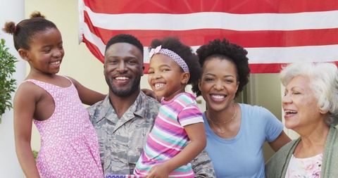 African American Veteran Smiling with Family on Homecoming Day