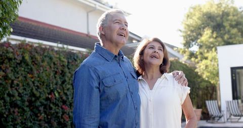 Happy Senior Couple Embracing Cheerfully Outdoors
