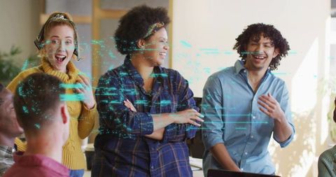 Multicultural team collaborating with digital code overlay during creative tech brainstorm