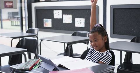 Confident Student Raising Hand in Classroom - Download Free Stock Images Pikwizard.com