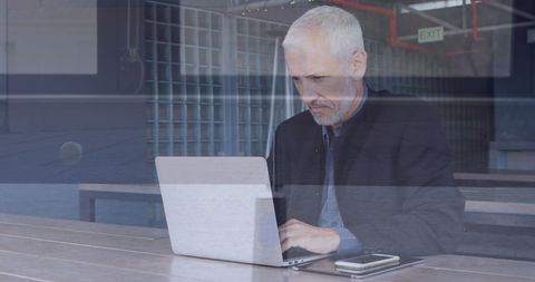 Caucasian Businessman Using Laptop in Modern Office - Download Free Stock Images Pikwizard.com
