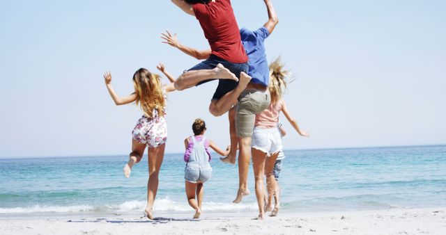 Joyful Friends Jumping on Beach in Summer - Download Free Stock Images Pikwizard.com