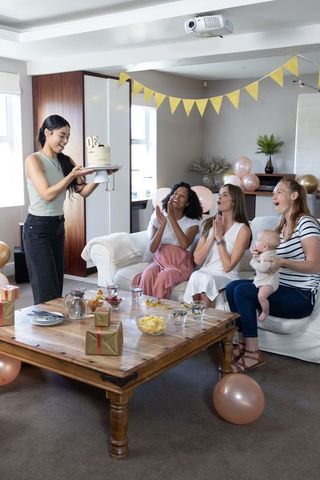 Joyful Birthday Celebration among Diverse Friends in Living Room