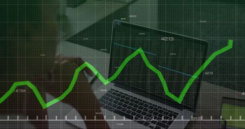 Digital Analytics on Laptop with Financial Charts Overlay