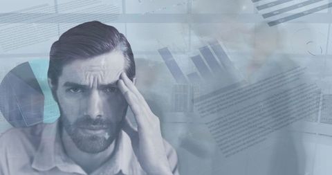 Businessman experiencing information overload and data analysis stress