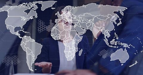 Colleagues collaborating on digital world map display