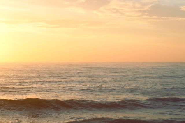 Calm Ocean with Golden Sunset and Gentle Waves in Horizon - Download Free Stock Photos Pikwizard.com