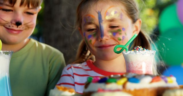 Children Enjoying Face Painting and Party Snacks outdoors - Download Free Stock Images Pikwizard.com