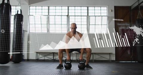 Shirtless athlete squatting holding kettlebells with digital fitness analytics overlay