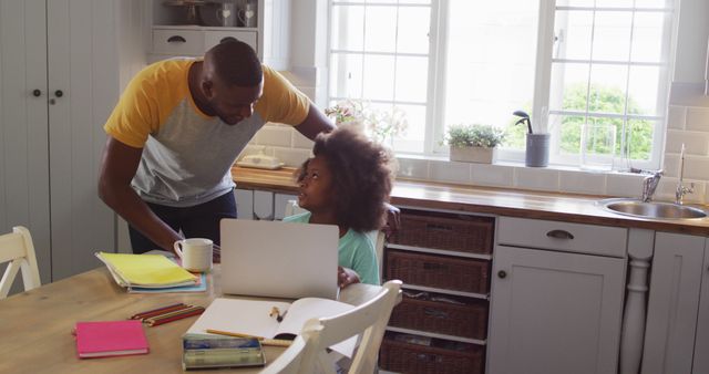 Father Assisting Child With Homework at Kitchen Table - Download Free Stock Images Pikwizard.com