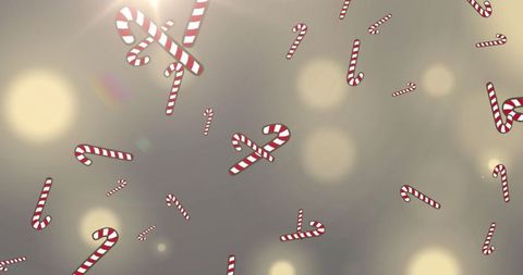 Falling christmas candy canes with glowing lights