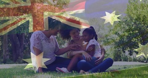 Sharing multigenerational family moment on lawn, embracing under australian flag overlay
