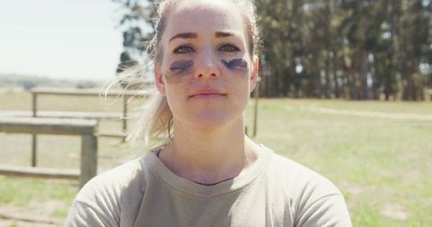 Confident Female Soldier Completing Obstacle Course Outdoors