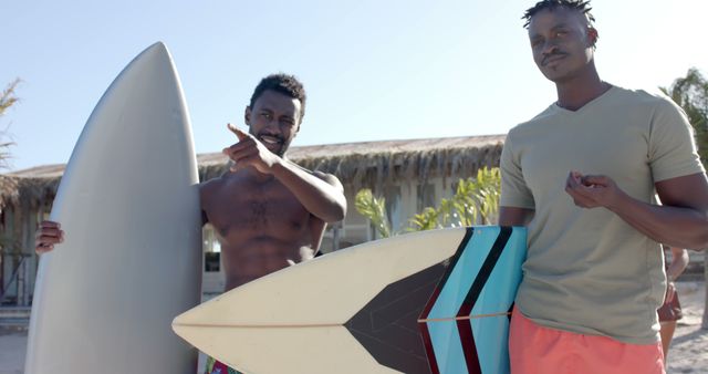 Two Friends with Surfboards on Beach - Download Free Stock Images Pikwizard.com