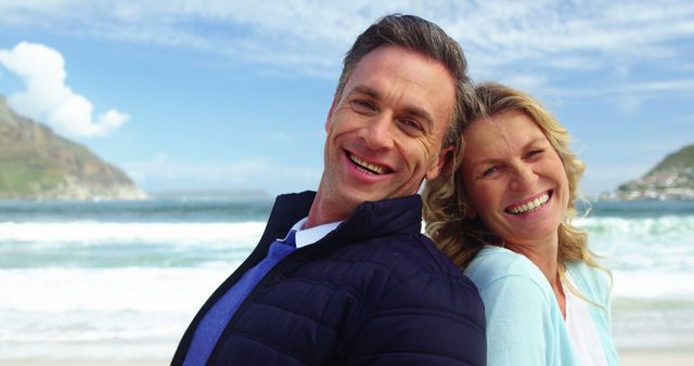 Smiling Middle-aged Couple Enjoying Beach Vacation on Sunny Day - Download Free Stock Images Pikwizard.com