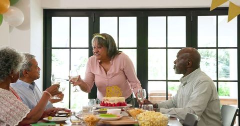 Senior Friends Toasting at 60th Birthday Party Celebration