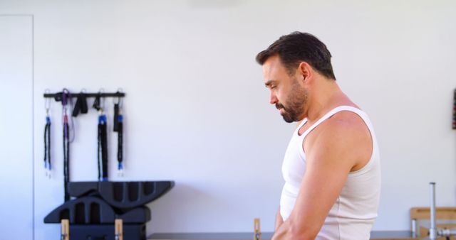 Man Wearing Tank Top in Fitness Studio - Download Free Stock Images Pikwizard.com