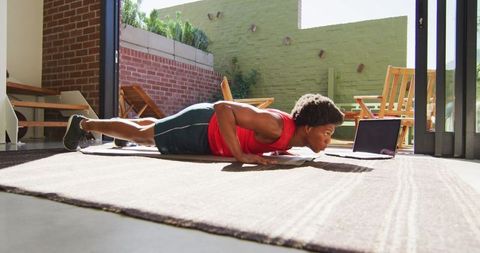 Fitness Enthusiast Doing Push-Ups in Living Room Environment