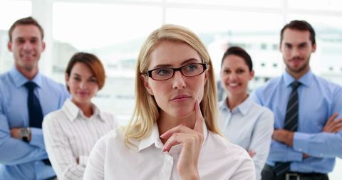 Confident Businesswoman Leading Team of Colleagues in Office - Download Free Stock Images Pikwizard.com