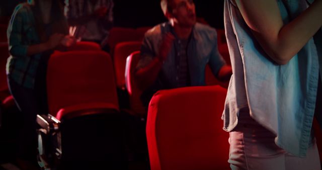 Diverse Audience Interacting in a Creative Space with Red Chairs - Download Free Stock Images Pikwizard.com