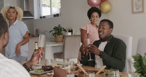 African american friends laughing and cheerful at home gathering celebration