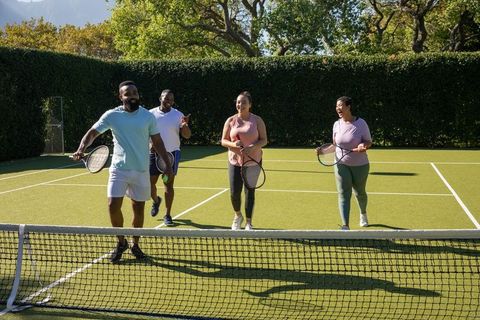 Group of Friends Enjoying Tennis on Sunny Day