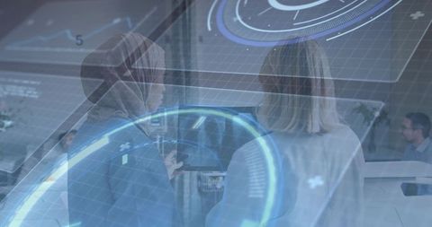 Colleagues Analyzing Holographic Display in Office Environment