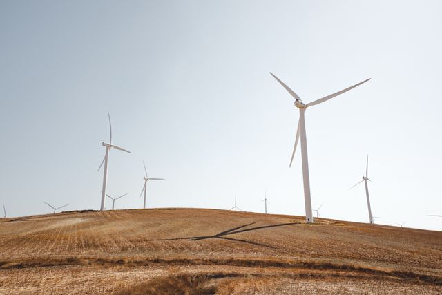 Wind Turbines Generating Renewable Energy on Dry Landscape - Download Free Stock Photos Pikwizard.com