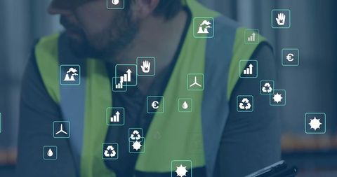Warehouse worker using tablet with ar sustainability and analytics icons