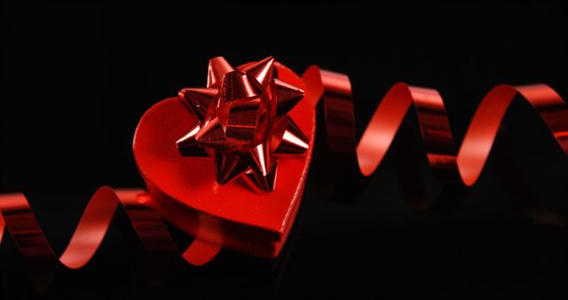 A heart-shaped box with a bow and ribbon symbolizes romance for occasions like Valentine's. - Download Free Stock Photos Pikwizard.com