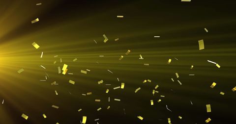 Golden Falling Confetti with Radiant Light Burst