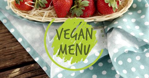 Vegan menu logo with fresh strawberries on rustic table