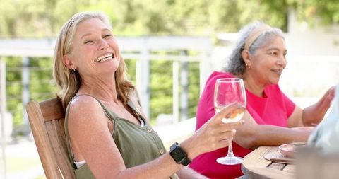 Senior Friends Enjoying Wine Outdoors Together - Download Free Stock Images Pikwizard.com