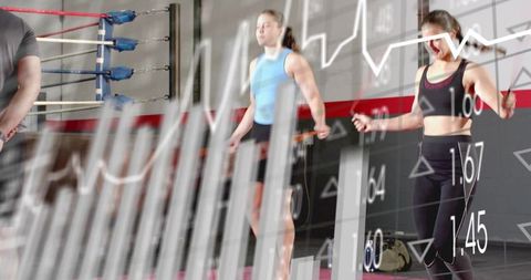 Women jumping rope in gym with fitness data overlay showing cardio metrics and team training