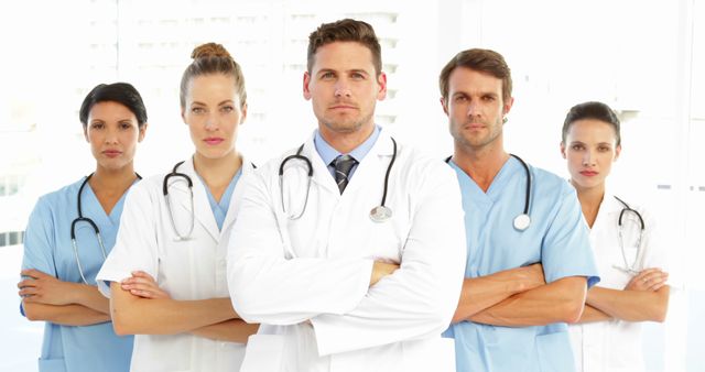 Confident Medical Team Standing with Arms Crossed in Hospital - Download Free Stock Images Pikwizard.com