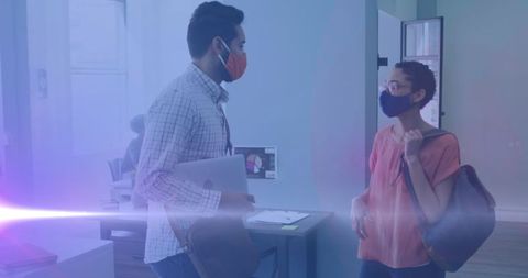 Colleagues elbow bumping in modern office undeer ethereal glow