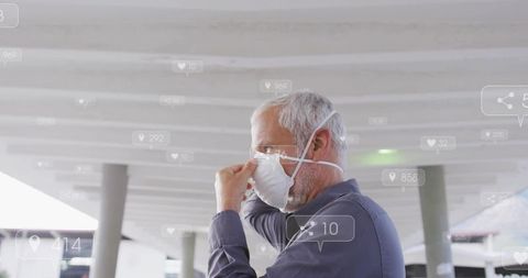 Adjusting senior man wearing n95 respirator on transit platform, digital media overlays
