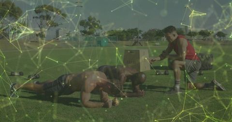 Outdoor team fitness training with coach assistance