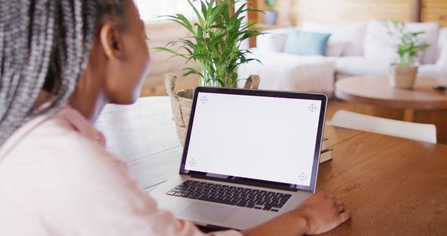 Woman Working From Home Using Laptop in Cozy Living Room - Download Free Stock Images Pikwizard.com