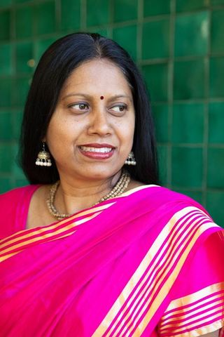 Elegant Indian Woman in Pink Sari with Jhumka Earrings