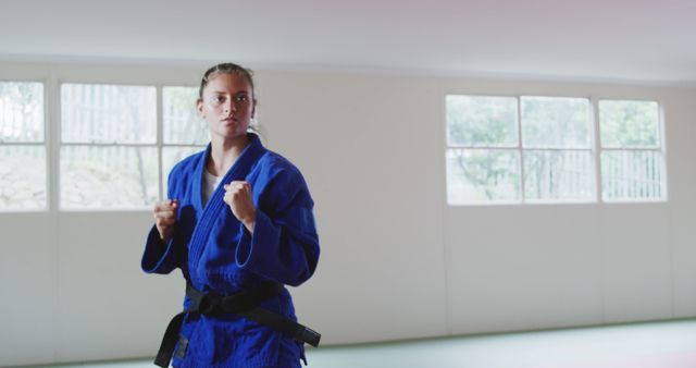 Woman Practicing Martial Arts in Traditional Judo Uniform Indoors - Download Free Stock Images Pikwizard.com