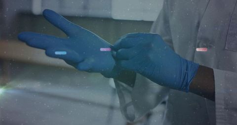 Doctor wearing blue nitrile gloves for safety management