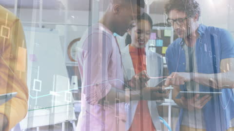 Diverse Professionals Analyzing Data with Technology in Office